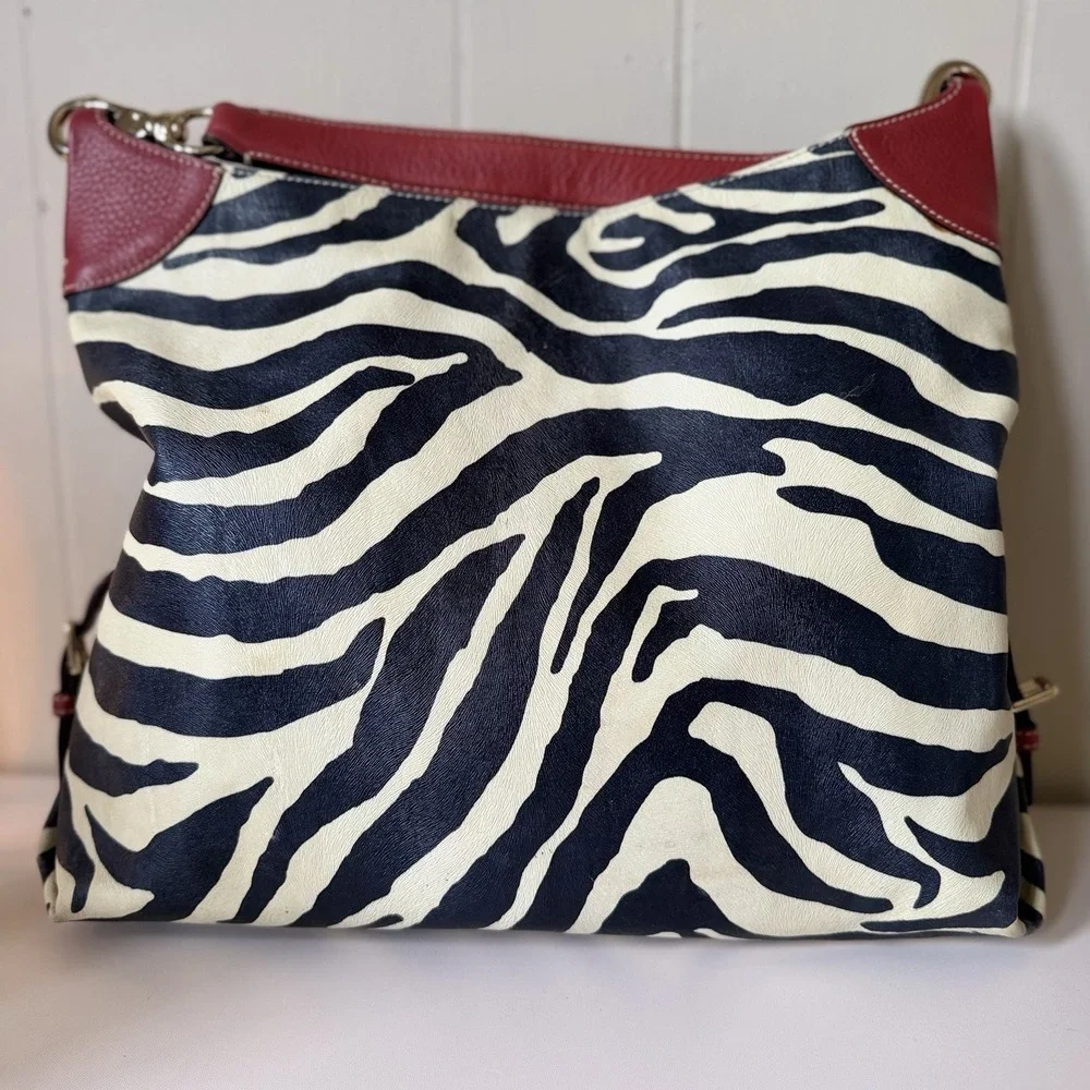 Dooney & Bourke Black and Cream Zebra Print Hobo with Red Trim